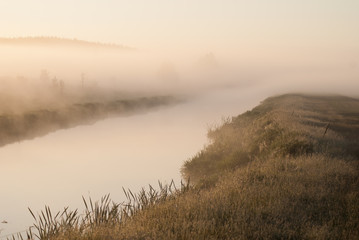  Mystical fog over the river at dawn