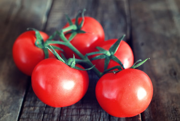 Wall Mural - tomatoes on wooden background