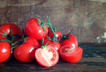 Wall Mural - tomatoes on wooden background