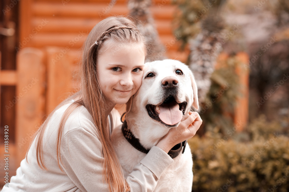  teenage girl and dog Smiling teen girl 14-16 year old holding labrador dog outdoors. Looking at  camera. Happiness. Friendship. Stock Photo | Adobe Stock
