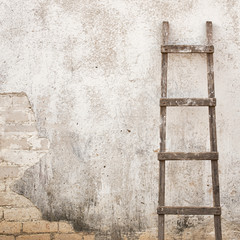 Wall Mural - weathered stucco wall with wooden ladder background