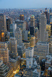 Fototapeta Nowy Jork - NYC skyscrapers in early evening light look like canyons in the