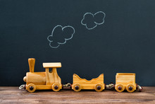 Old Wooden Toy Train With Steam On The Chalkboard Background