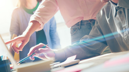 Fototapete - Project discussion. Business team meeting. Laptop and paperwork on the table. Film effect, blurry background, lens flare effect