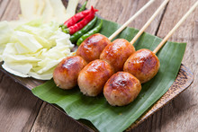 Red Chili Isaan Sausage With Vegetable On Wood Background.