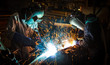 © taaee - Teamworker with protective mask welding metal