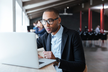 Sticker - Young businessman working with laptop