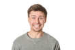 © Terence Mendoza - Happy young man with manic expression, on gray background