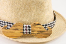 Wooden Bow Tie Around A Hat.