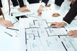 © Africa Studio - Team of professional engineers working with blueprints