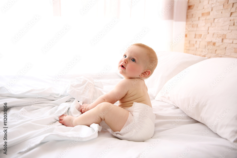 Cute baby boy on the bed