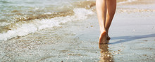 Woman Walking On Sandy Beach, Foots On Sea Waves