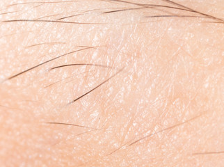 human skin with hairs as a background. macro