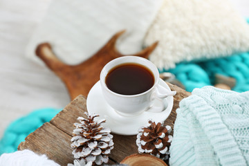 Beautiful winter composition with cup of hot drink