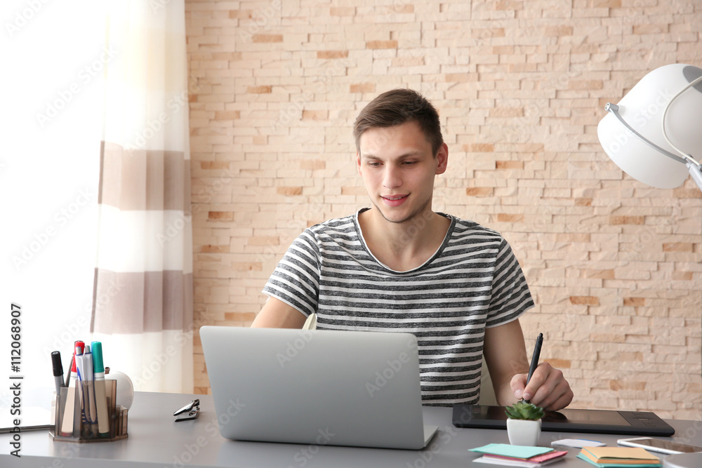 Man working at computer at office