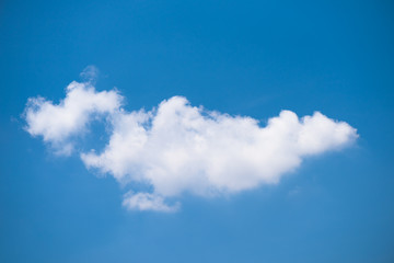 Wall Mural - single clouds on blue sky