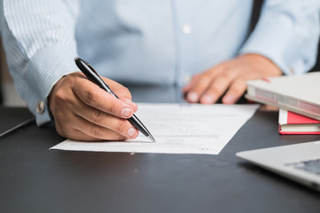 Businessman in elegant suits working with documents sign up contract 
