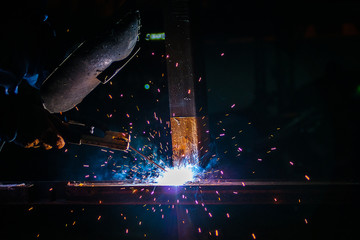 steel welding at industrial, worker on working area with protect