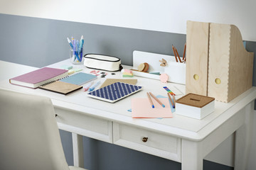 Wall Mural - Office and school set with stationery and notebooks on a table