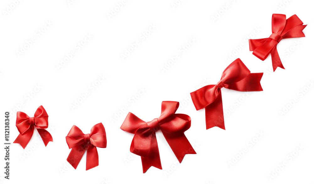 Red ribbon bows on a white background