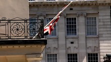 English Flag Swinging On The Balcony Of A Building