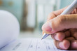 © olando - Hand with pen over application form