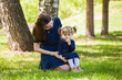 © izida1991 - Mom and daughter on a walk in the summer park