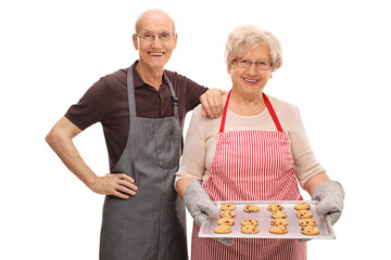 Sticker - Senior couple posing with homemade cookies