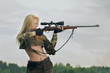 © boomeart - Pretty hunter girl aiming with hunting rifle in the outer wood.