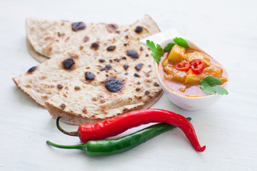 Wall Mural - Indian tikka masala chicken and naan flat bread