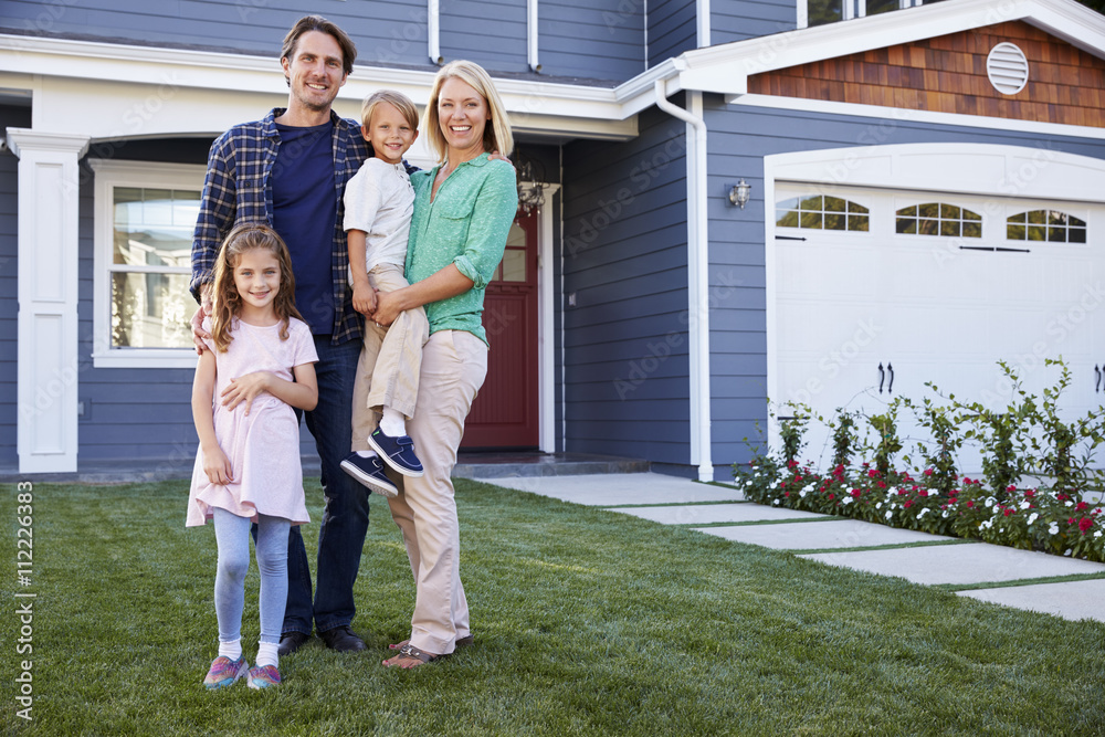 Portrait Of Family Standing Outside House Stock Photo | Adobe Stock
