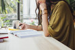 © Lumina Images/Blend Images - Caucasian woman studying at desk
