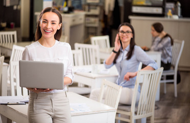 Sticker - Nice smiling  woman holding laptop 