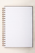 © sripfoto - Blank Notebook with Line Paper on cement wall Background.