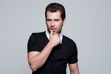 Wall Mural - Portrait of young man in black shirt.