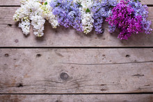 Border From Fresh Aromatic Lilac Flowers On Vintage Wooden Plank