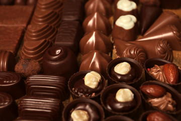 Canvas Print - Assortment of delicious chocolate candies background, close up