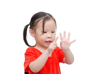 little asian girl counting her finger over white