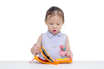 Wall Mural - Little asian girl reading book over white background