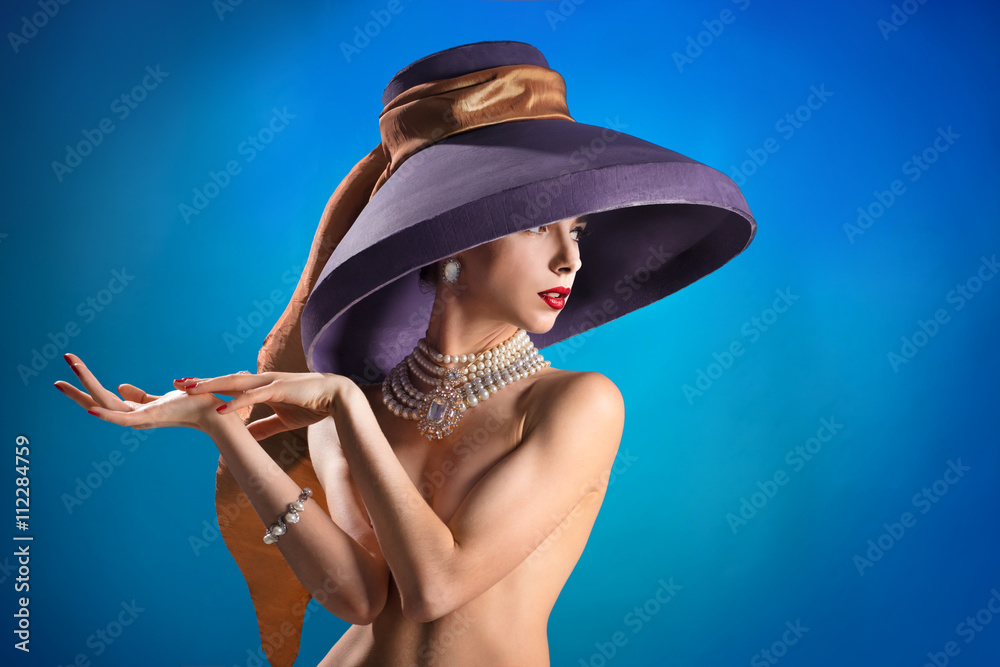 Fashionable girl, movie actress, nude, only one in a vintage hat Stock