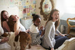 © Guerilla - Teenage Girls With Pet English Bulldog In Bedroom At Home