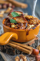 Wall Mural - Ceramic bowl of oatmeal baked with apple and cinnamon.