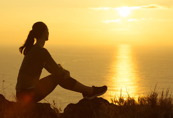 Woman enjoying the beautiful sunset. 