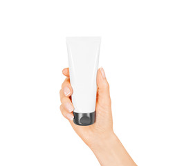 Wall Mural - Hand hold blank white tube mock up isolated. Empty cream bottle mockup template holding in hands. Tube design presentation. Skin care mockup. Skincare tube design,

