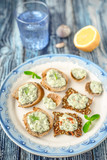 Fototapeta Maki - Plate with different bread with tzatziki on the blue table vertical