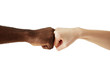 Black African American man touching knuckles with white Caucasian woman in agreement, partnership and cooperation. Two people of different cultures and races greeting each other in modern handshake