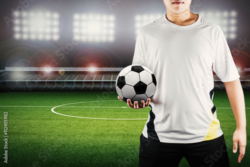 Fotografie, Tablou player holding ball with stadium background