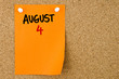© stanciuc - 4 AUGUST written on orange paper note