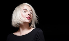 Fashionable Woman With Red Lipstick And Short Hair On Black Background