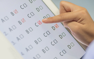 Wall Mural - student testing in exercise, exams answer on a tablet with multi